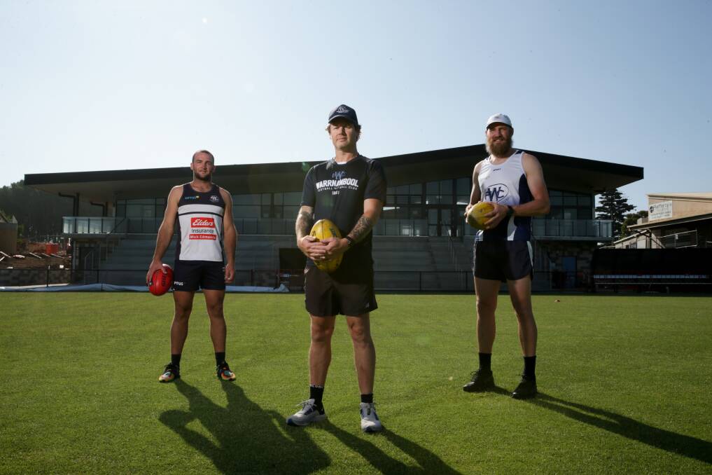 NEW ERA: Warrnambool footballer Tom Ludeman, coach Ben Parkinson and player Dan Weymouth on the new Reid Oval in February. Picture: Chris Doheny