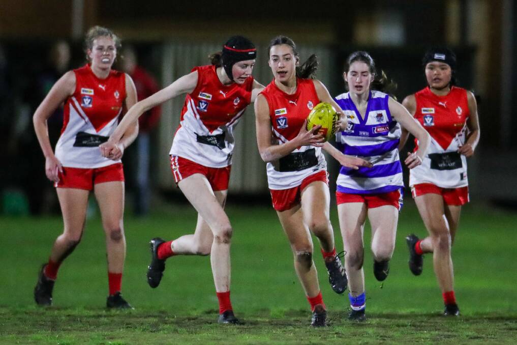 OUT OF THE PACK: South Warrnambool's Abbey Titmus breaks away from congestion against Terang Mortlake in the final under 18 round. Picture: Morgan Hancock 