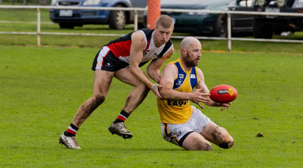 Koroit's Will Petersen tries to stop North Warrnambool Eagles' Nick Rodda from taking a mark. Picture by Anthony Brady