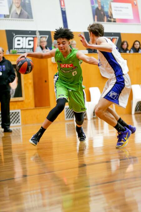 GAME ON: Warrnambool Seahawks teenager Malakye Cunningham dribbles past a Melbourne University opponent on Saturday night. Picture: Chris Doheny