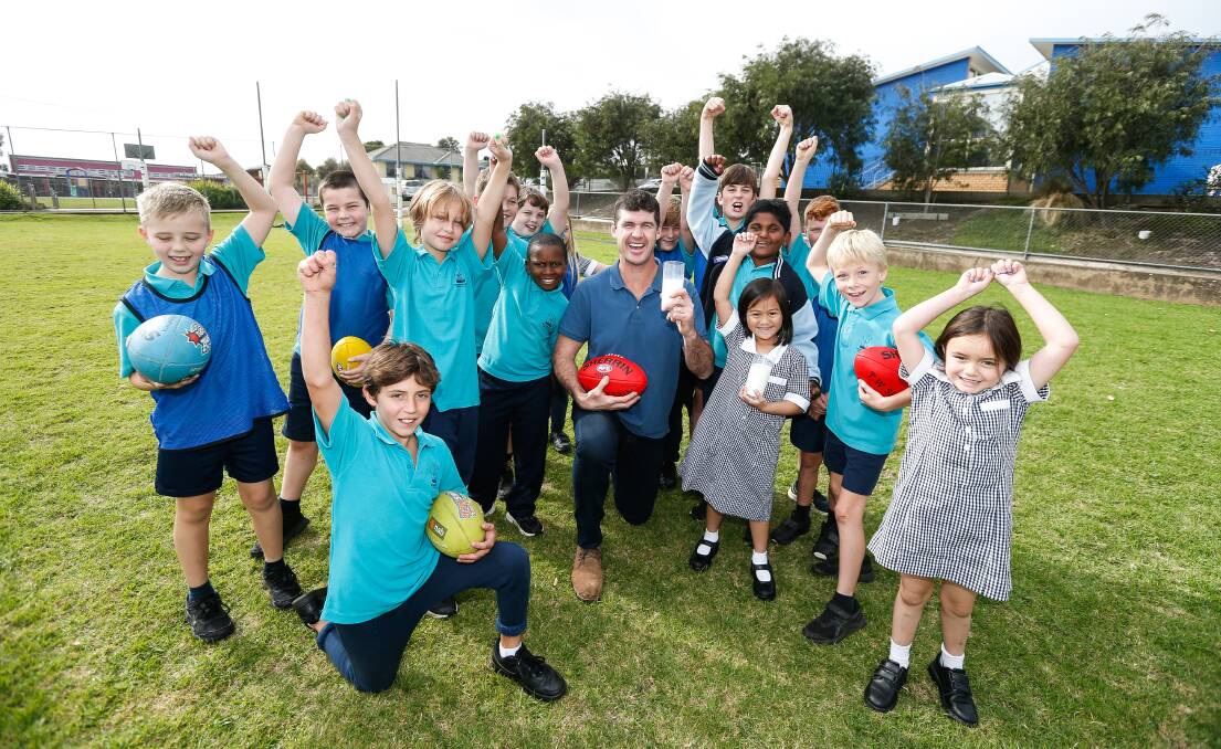 CHEERS: Jonathan Brown promoting the Picasso Cows program at Warrnambool West Primary School. Picture: Anthony Brady