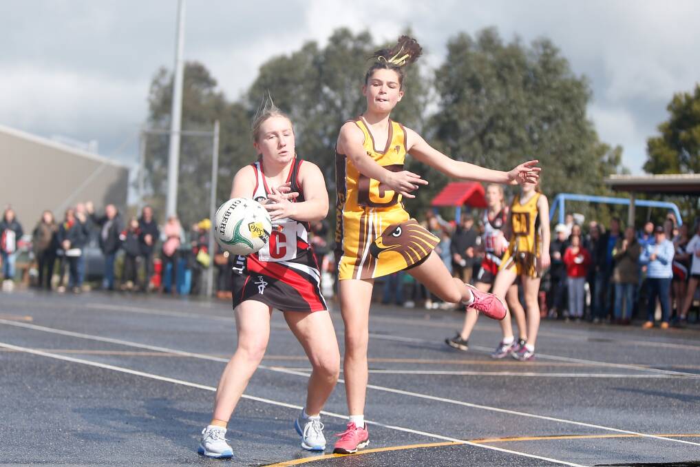 BATTLES ON HOLD: Koroit's Bridget Haberfield and Hawks' Ailsa Gome compete for the ball during a Hampden 14 and under game last year. The 2020 season is in limbo due to COVID-19 restrictions. Picture: Mark Witte