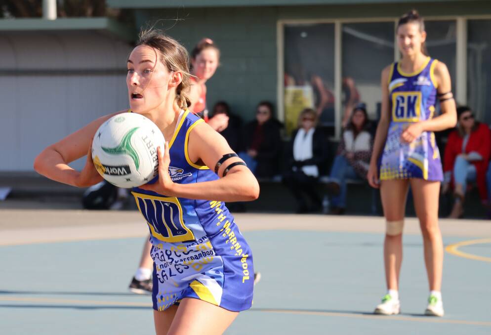 QUICK PASS: North Warrnambool Eagles' Ella Grundy looks to dish off the ball. Picture: Justine McCullagh-Beasy