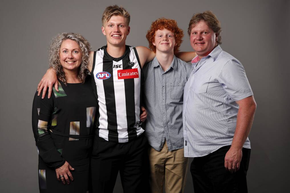 PROUD AS PUNCH: Jay Rantall with mum Lia, brother Wil and dad Tim after he was drafted to Collingwood. Picture: Getty Images