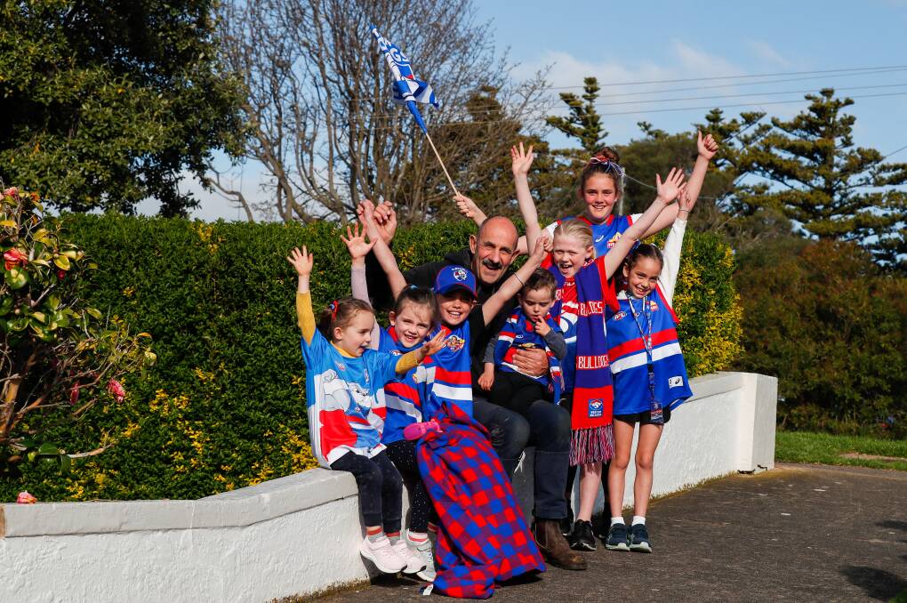 RED, WHITE AND BLUE: Former player Alby Smedts and his grandchildren will be cheering for Western Bulldogs in Saturday night's grand final. Picture: Morgan Hancock 