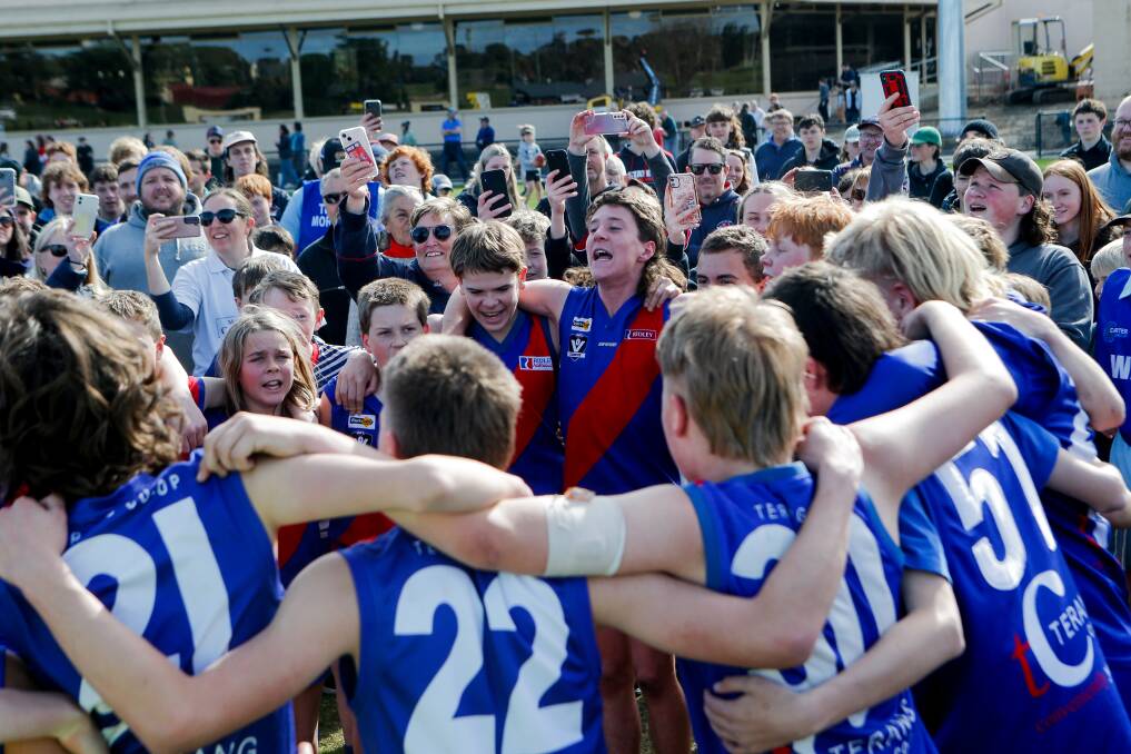 PUMPED UP: Terang Mortlake players belt out the Bloods' song after winning the under 14 grand final. Picture: Anthony Brady 