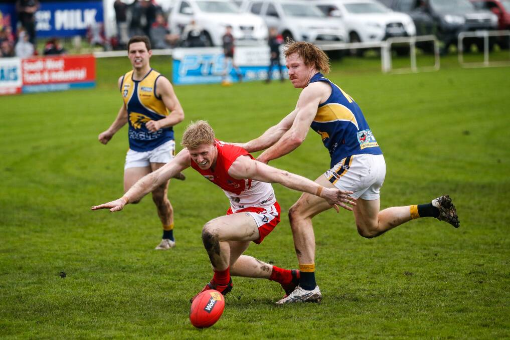 South Warrnambool defender Harry Lee protects the ball from North Warrnambool Eagles' Adam Wines. Picture by Anthony Brady 