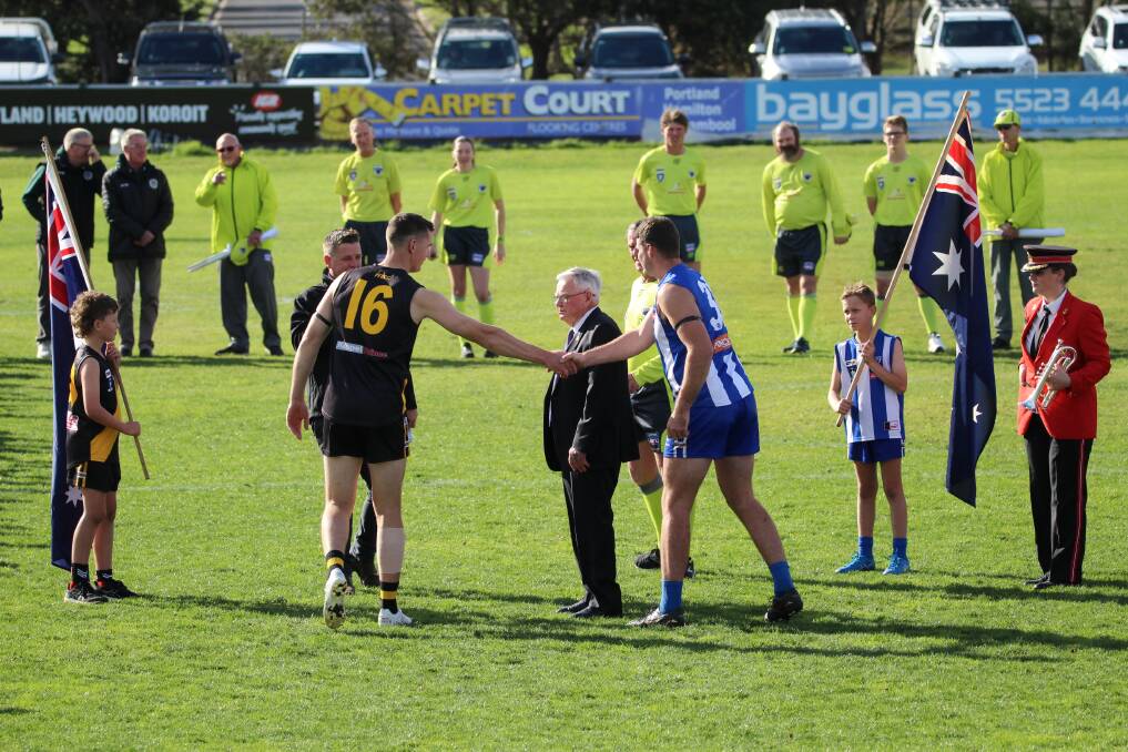 Portland's Ben Malcolm and Hamilton Kangaroos' Darcy Russell shake hands before the match. Picture by Tayla Ness 