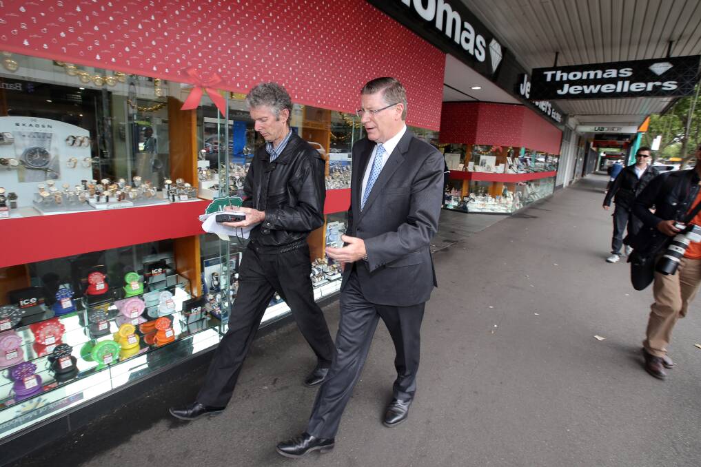 The Standard journalist Peter Collins interviews then-Victorian Premier Denis Napthine on Warrnambool's Liebig Street in 2014. 