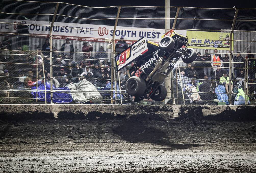 American Chase Randall flips his car on turn four during Sunday night's classic A-Main. Picture by Sean McKenna 
