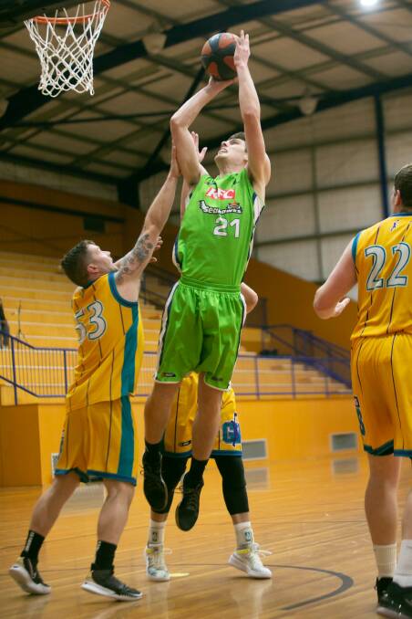 TO THE BASKET: Riley Nicolson lines up a shot for Warrnambool against Coburg on Saturday night. Picture: Chris Doheny