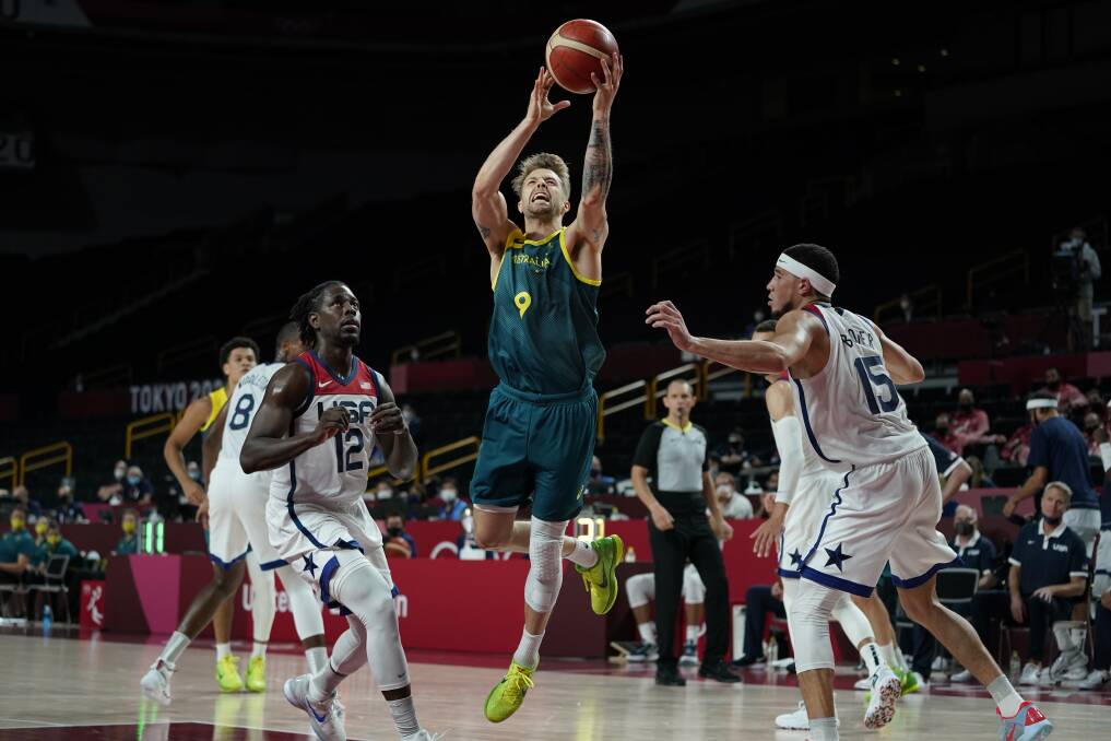 DRIVING TO BUCKET: Warrnambool export and Australian Nathan Sobey goes to the basket against Team USA. Picture: AP Photo/Charlie Neibergall