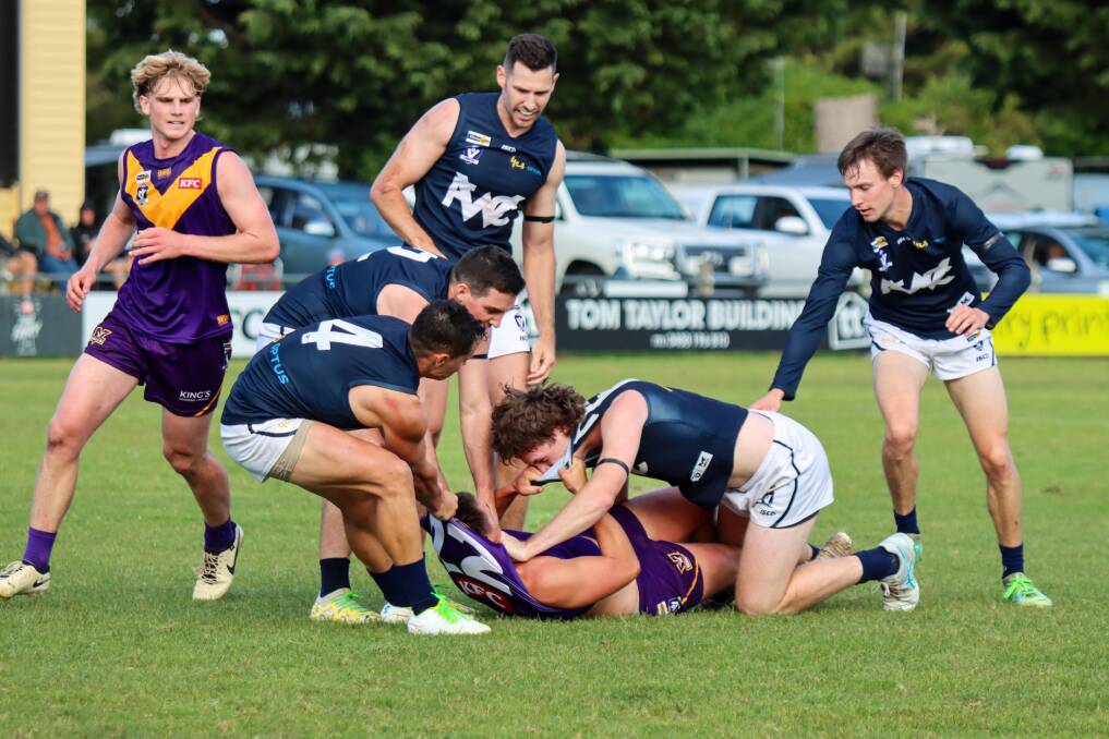 Port Fairy and Warrnambool footballers tussle during their clash at Gardens Oval. Picture by Justine McCullagh-Beasy 