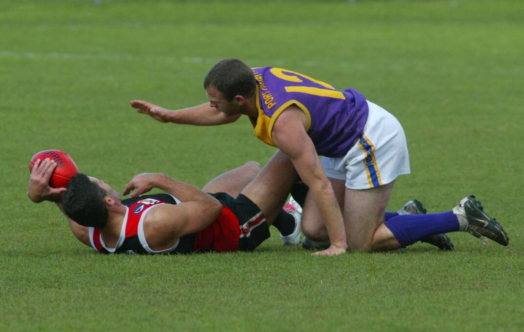 LEADERS: Koroit coach Jason Mifsud and Port Fairy coach Brad Sholl battle for possession in the 2005 Hampden league preliminary final. 