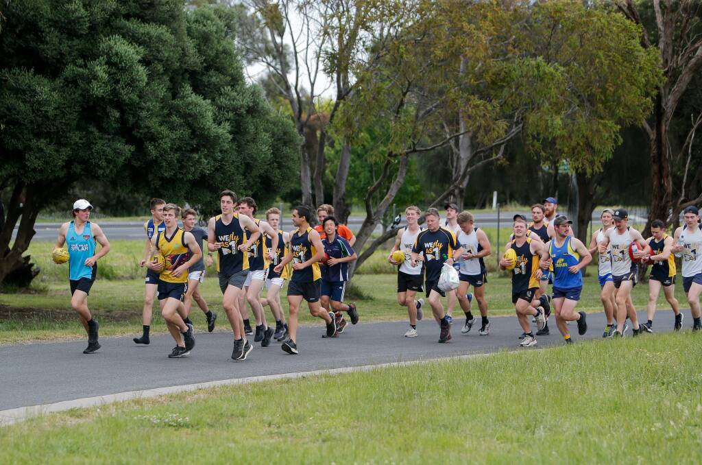 HARD YARDS: Footy clubs can soon add contact drills to their pre-season running sessions. Picture: Anthony Brady