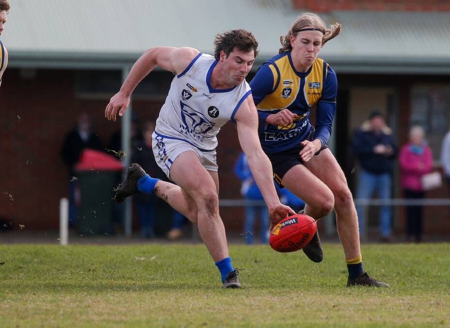 CONTEST: Hamilton Kangaroos' Charles Murrie and North Warrnambool Eagles' Jett Bermingham battle for possession at Bushfield on Saturday. Bermingham was in the Eagles' best and kicked three goals. Picture: Anthony Brady