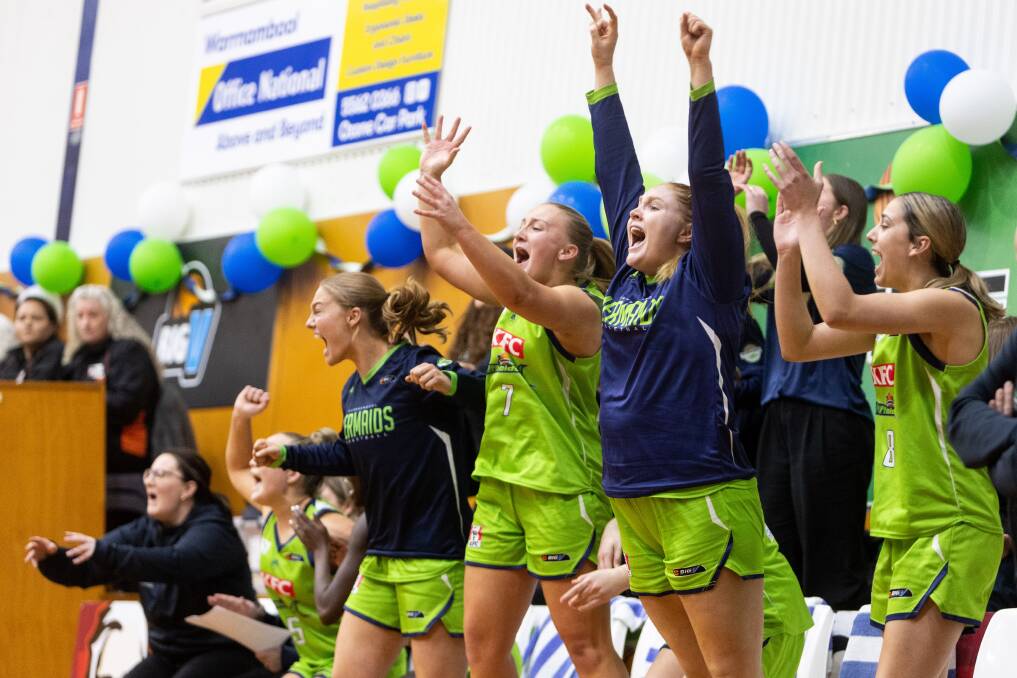 Warrnambool Mermaids' bench erupts on the final buzzer. Picture by Anthony Brady 