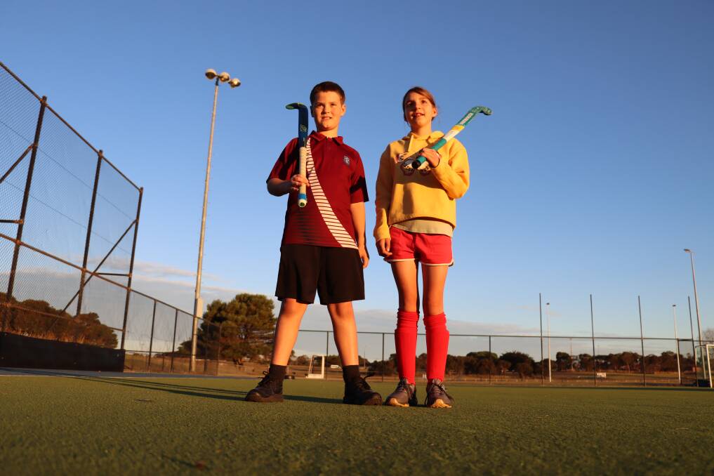GAME ON: Dietrich Iles, 11, and Ruby Prentice, 12, are ready for the new hockey season in Warrnambool. Picture: Justine McCullagh-Beasy 