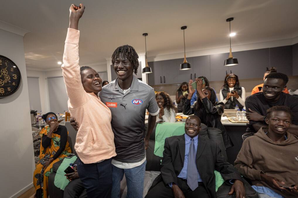 Luamon Lual soaks up being drafted to Essendon with his family and friends. Picture by Sean McKenna 