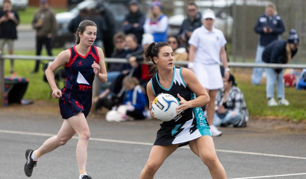 Kolora-Noorat's Molly Bourke dishes off a pass against Timboon Demons in the elimination final at Davidson Oval. Picture by Anthony Brady 