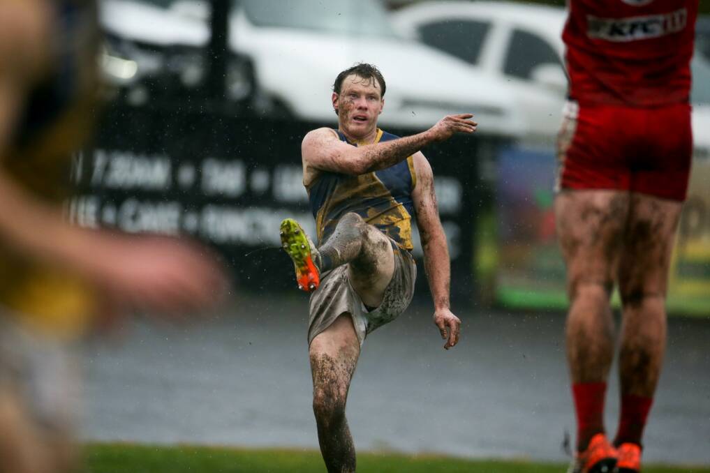 Tom James in action for North Warrnambool Eagles on a muddy, wet south-west day in 2021. File picture 