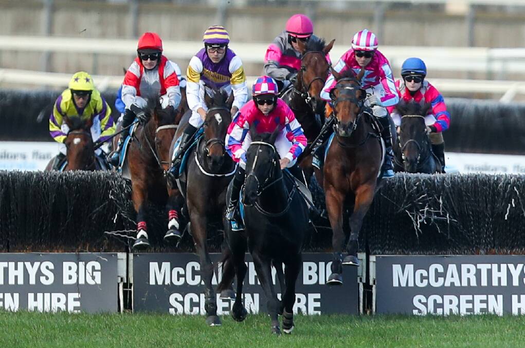 LEADER OF THE PACK: A field of horses and jockeys compete for position during race four at Warrnambool on Wednesday. Picture: Morgan Hancock