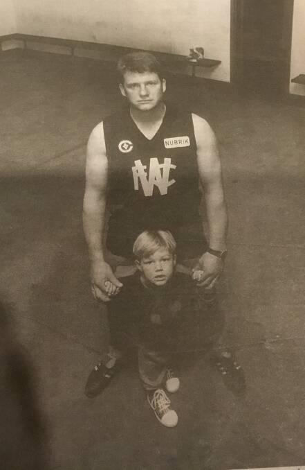 FATHER AND SON: Grant Thomas and oldest child Claye in Warrnambool in the 1980s. 