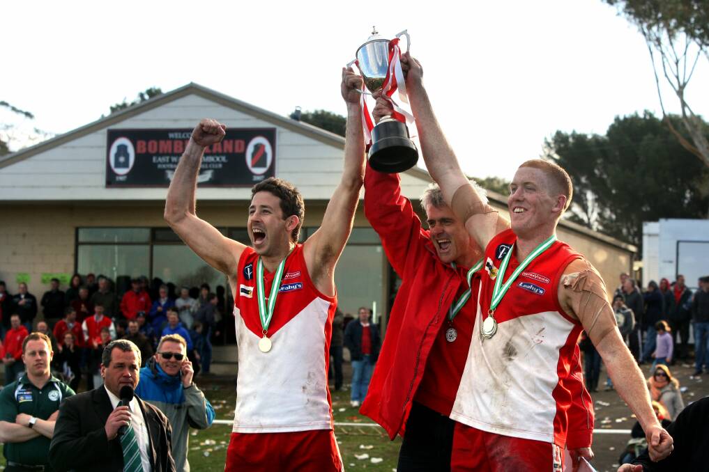 C'MON: Danny Finn, Nigel Kol and Jarrod Thompson celebrate South Warrnambool's 2011 premiership. 