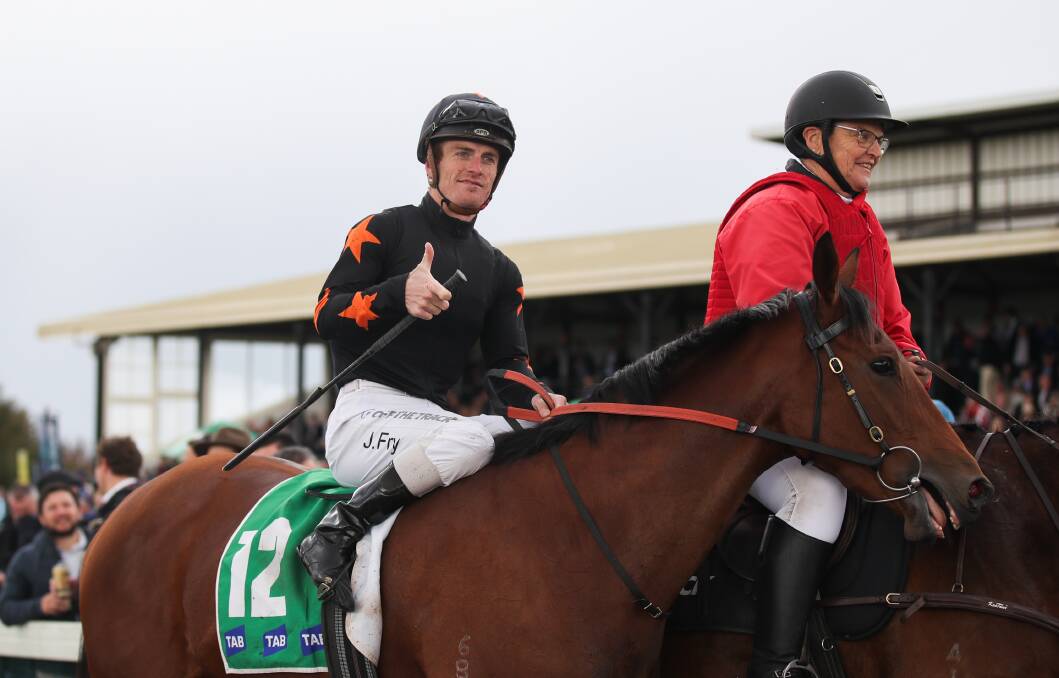 THUMBS UP: Jarrod Fry walks Dustland Fairytale back to the mounting yard after winning race two. Picture: Morgan Hancock 