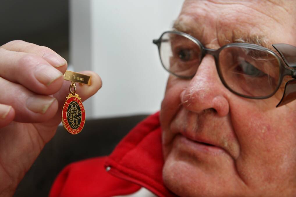 Ken Timms with his life membership pin he received from the Essendon Football Club. File picture 