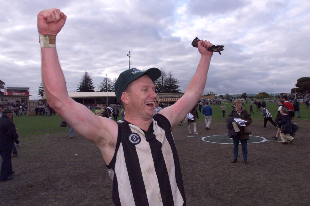 PREMIERSHIP PIE: Ken Hinkley celebrates Camperdown's 1999 flag at Warrnambool's Reid Oval. He will become an AFL life member when he takes part in his 300th game at the elite level on Sunday. 