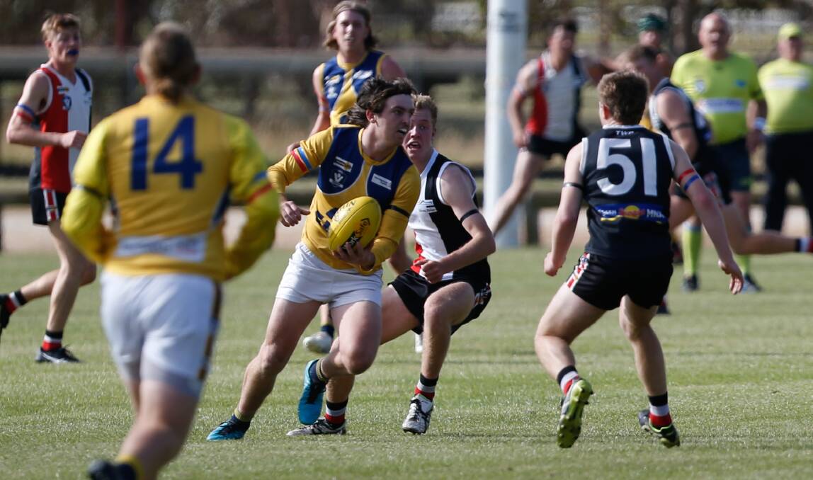 PLAYMAKER: North Warrnambool Eagles' Bailey Jenkinson works his way through traffic against Koroit. Picture: Emma Stapleton 