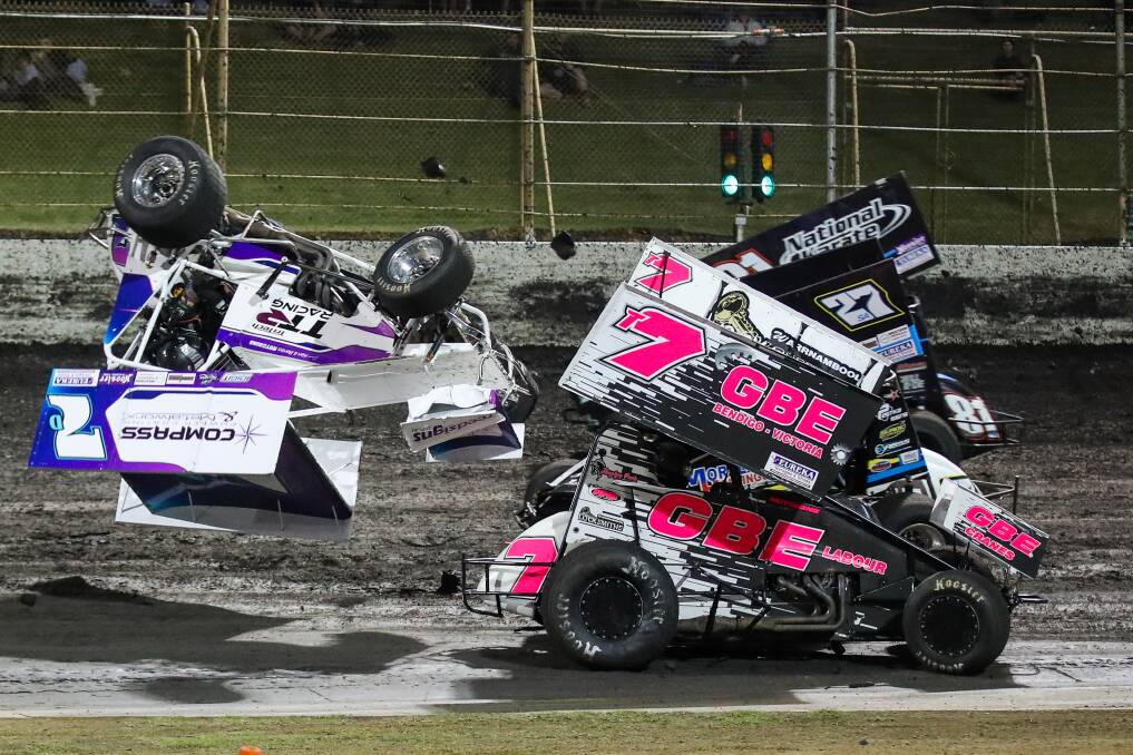CARNAGE: Drivers involved in a massive crash in Saturday night's A-Main, including Allansford's Matthew Reed (car on its roof). Pictures: Morgan Hancock 