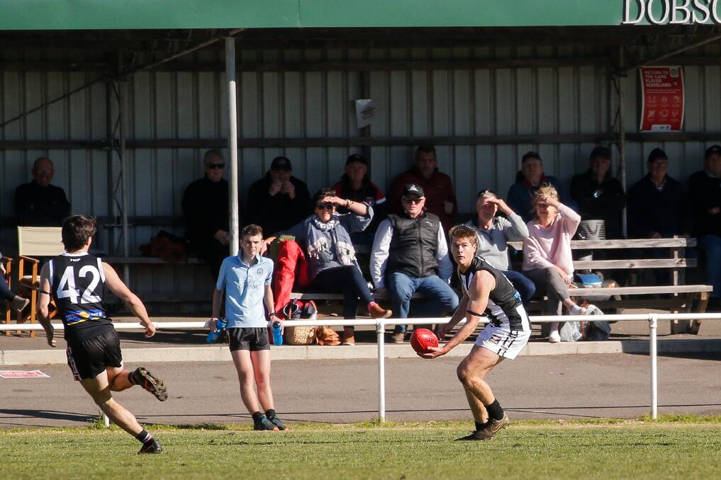 OPTIONS: Camperdown's Riley Arnold looks for a teammate against Koroit. Picture: Anthony Brady