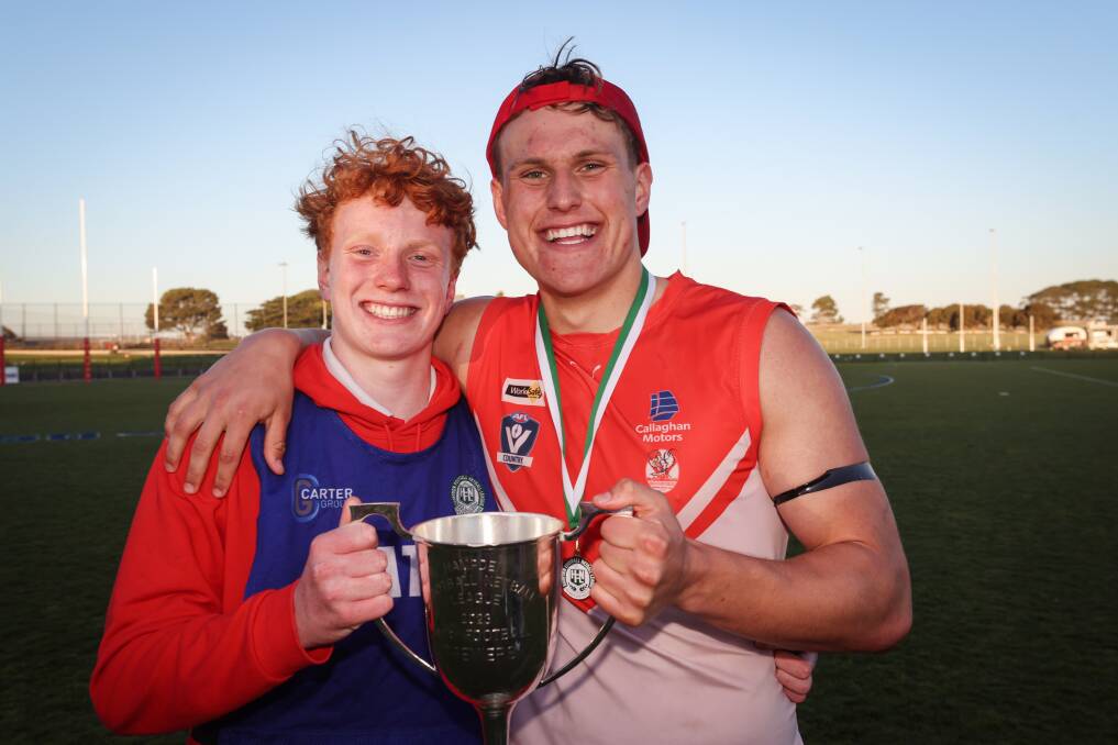 George Stevens (right) with younger brother Jimmy after becoming a South Warrnambool senior premiership player in September 2023. Picture by Sean McKenna 