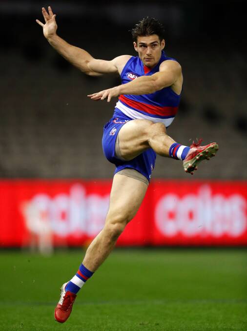 KICKING ON: Western Bulldogs defender Easton Wood returned from a quad injury last weekend. Picture: Getty Images 