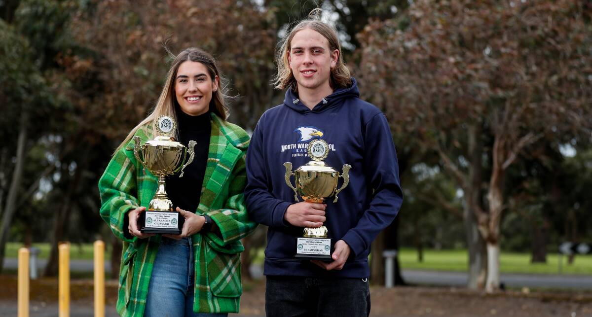 DYNAMIC DUO: Ally O'Connor (open netball) and Jett Bermingham (senior football) with their best and fairest trophies. Picture: Morgan Hancock 