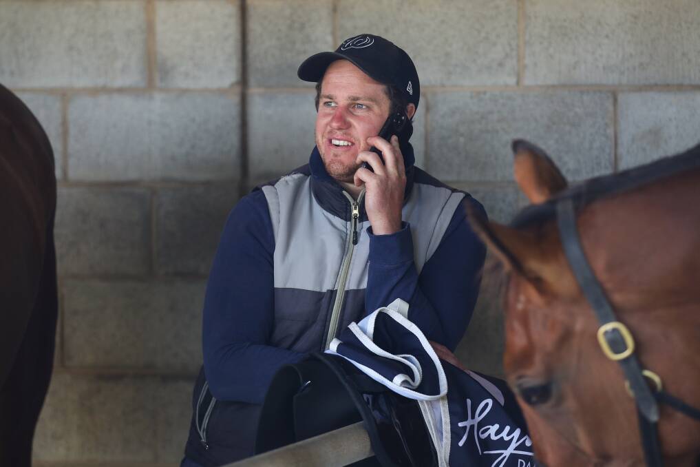 TRACKSIDE: Liam Hoy, who works as a stable foreman for Symon Wilde, at the Warrnambool races on Thursday. Picture: Morgan Hancock 