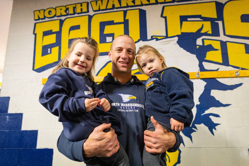North Warrnambool Eagles footballer Matthew Wines, pictured with daughters Isla, 3, and Amelia, 2, will play his 300th game on Saturday. Picture by Sean McKenna 