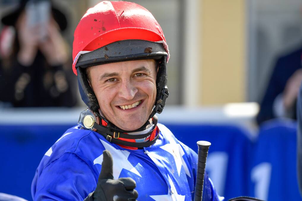 IN THE SADDLE: Jockey Tom Ryan hopes he's smiling after the Grand Annual Steeplechase in Warrnambool on Tuesday. Picture: Reg Ryan/Racing Photos 