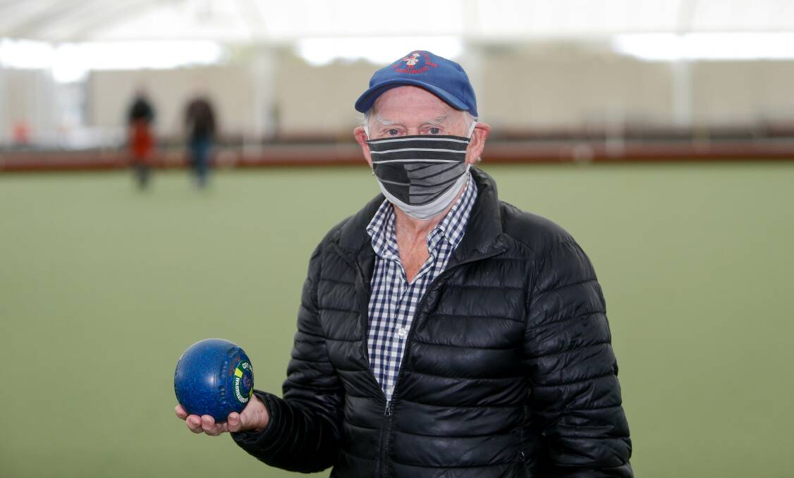 SIGN OF THE TIMES: Long-time City Memorial Bowls Club player Leo Dunne dons his mask amid stage three coronavirus restrictions in Victoria. He is grateful he can still go for a roll on the greens. Picture: Anthony Brady 