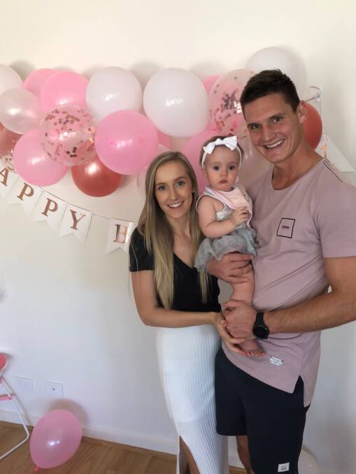 HAPPY: Luke Thompson with wife Caitlin and daughter Lacie. 