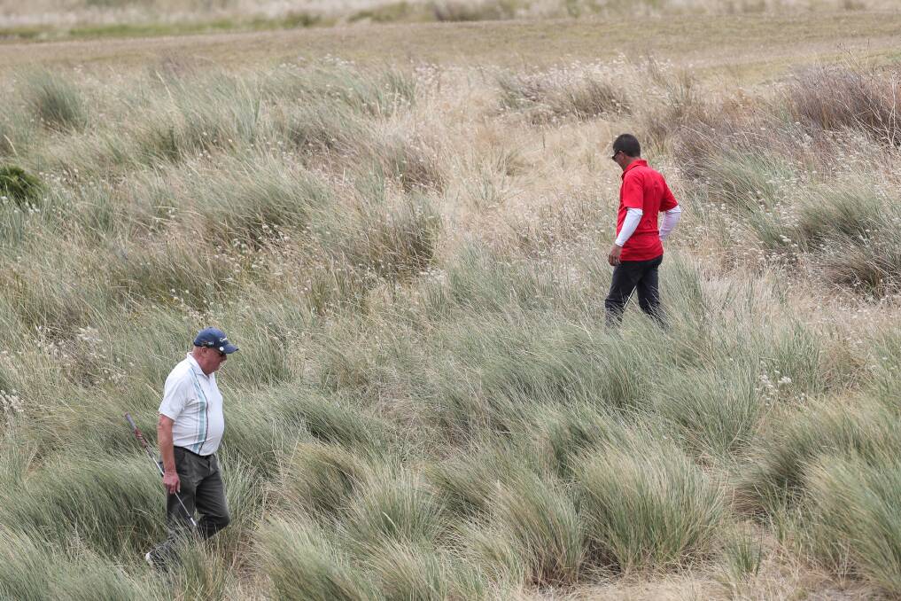 FLASHBACK: Russell Helman and Ben Hay, both of Warrnambool, search the rough for a lost ball at Port Fairy in 2017. Picture: Rob Gunstone