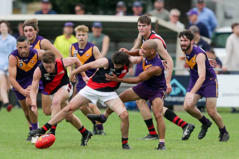 SEE BALL GET BALL: Cobden and Port Fairy players battle for possession at Gardens Oval. Picture: Chris Doheny 