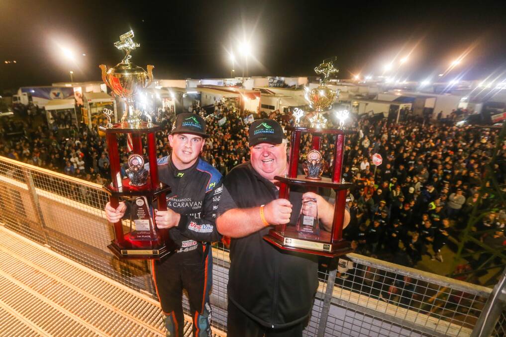FATHER-SON MOMENT: Corey and Bryan McCullagh with the 2018 Grand Annual Sprintcar Classic spoils in front an adoring crowd. Picture: Morgan Hancock 