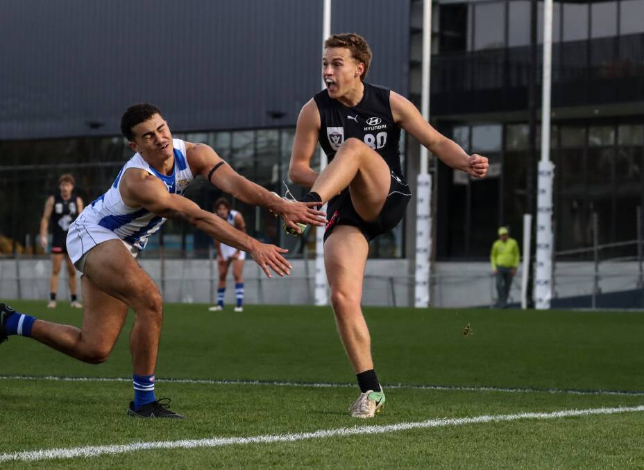 KICKING ON: Archie Stevens in action for the Blues during his first VFL game. Picture: Carlton FC 