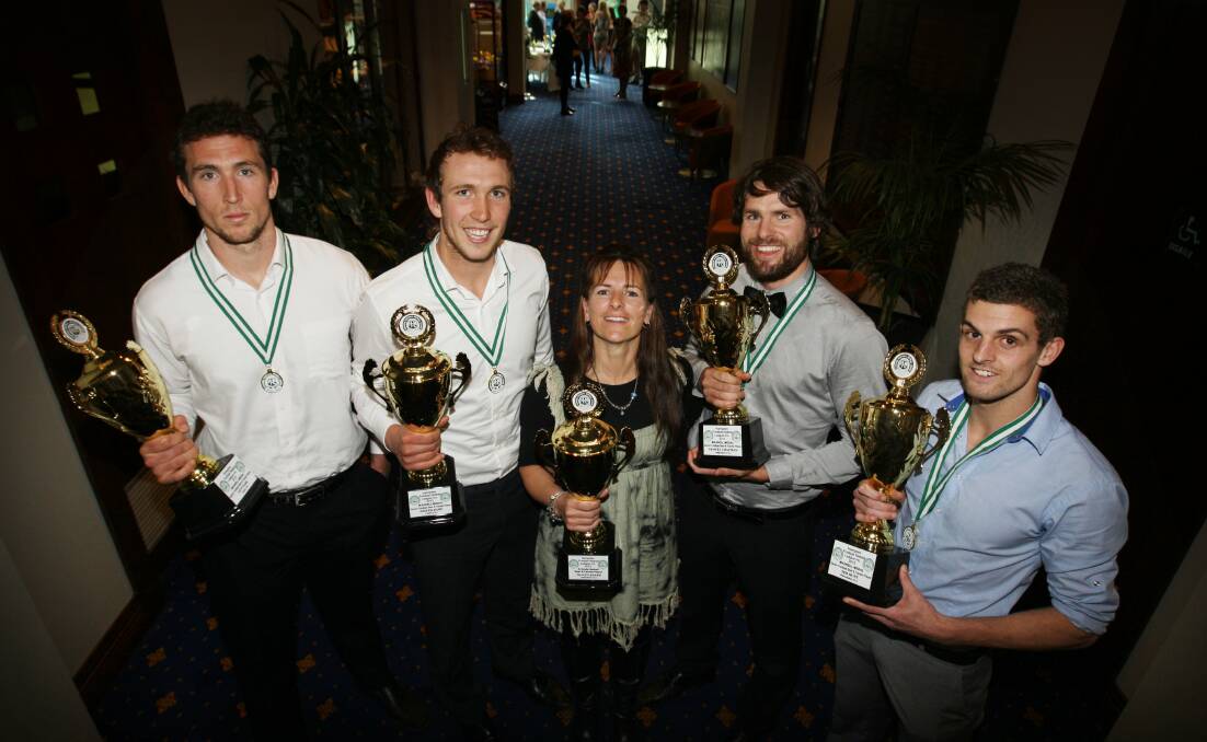 HIGH FIVE: Tracey Baker surrounded by joint football best-and-fairest winners Levi Dare, Joe Dare, Sam Chapman and Tim Hunt after she won the Hampden netball top award for the 2012 season. 