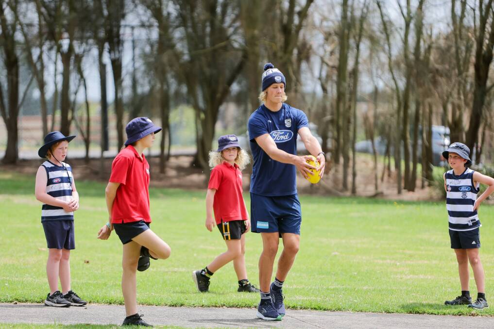 Sam De Koning enjoyed teaching Cudgee Primary School students football skills on Monday. Picture by Anthony Brady 