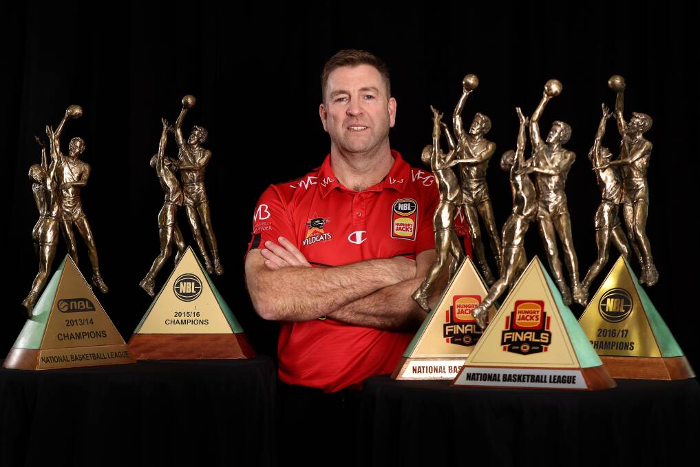 DOMINANT: Trevor Gleeson with his fiev NBL championship trophies. He spent eight seasons as Perth Wildcats coach. Picture: Getty Images 