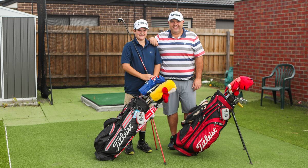 SMART IDEA: Paul and Lachie Walker have built a mini golf complex in their backyard. Journalist Nick Ansell also purchased a practice net. Picture: Morgan Hancock